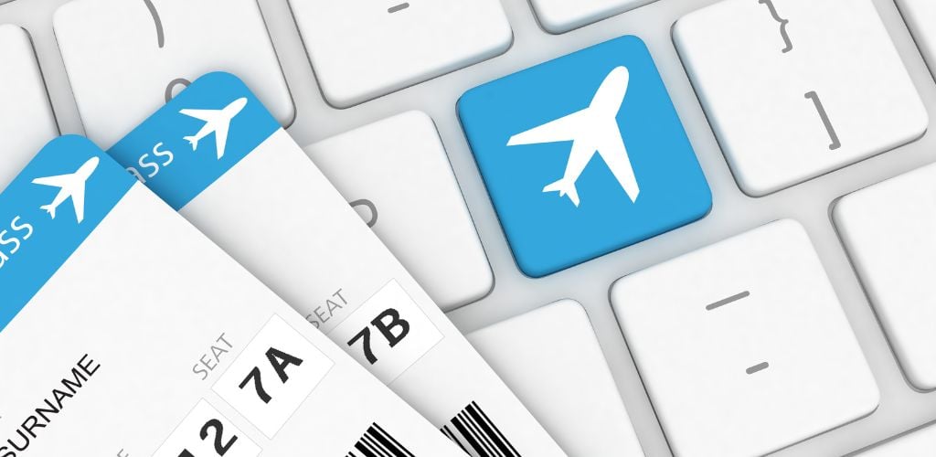 Internet travel vacation flight ticket booking and a keyboard with sign of airplane