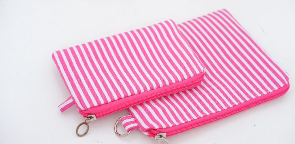 Beautiful pink and white stripes Canvas Pouch. 