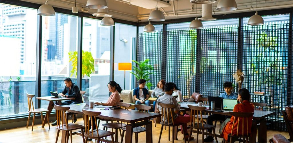 A group of people busy working in co-working space.