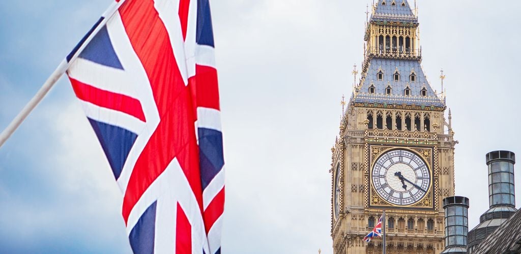 Big Ben, London, UK. A view of the popular London landmark, the clock tower Big Ben. British flag flying. 