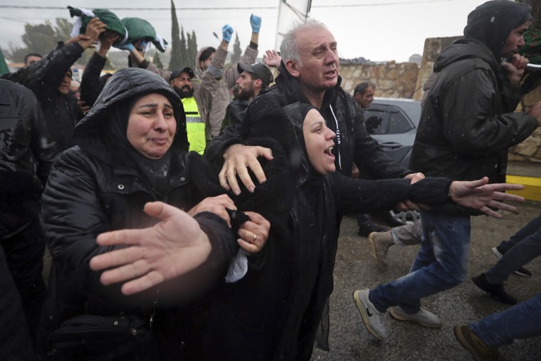 Amal Atwi, the mother of Hussein Jalal Mohsin, who was killed in an Israeli strike last night, mourns during his funeral procession in Qantara, south Lebanon, Thursday, Feb. 15, 2024.