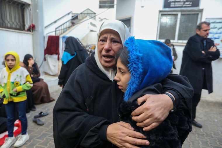 Mourners receive the bodies of victims of a strike on Feb. 9, 2024 in Rafah, Gaza. 