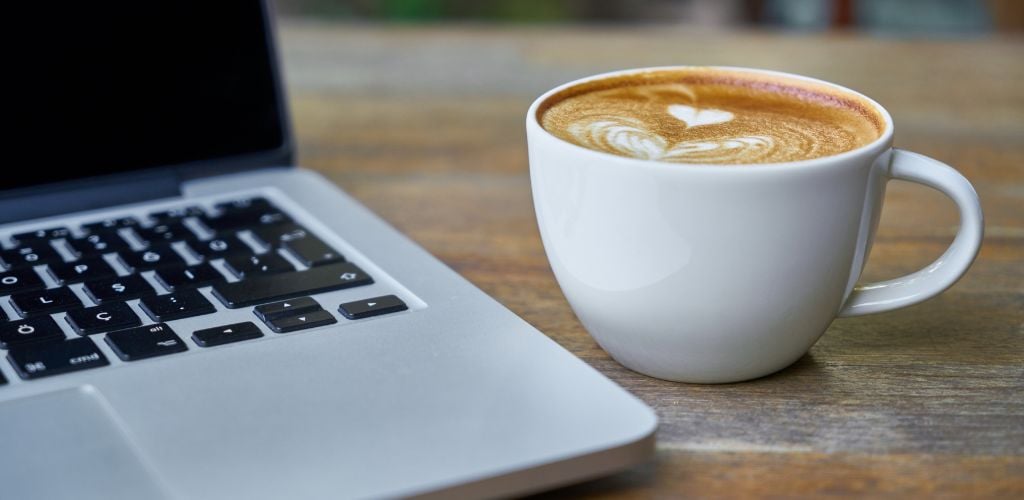 digital nomad lifestyle laptop and coffee