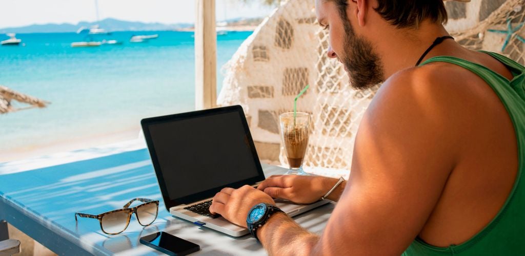 beach laptop digital nomad