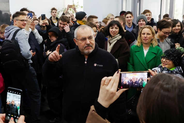 Boris Nadezhdin, an anti-war candidate who was barred from running in the election, meets students after voting in Dolgoprudny