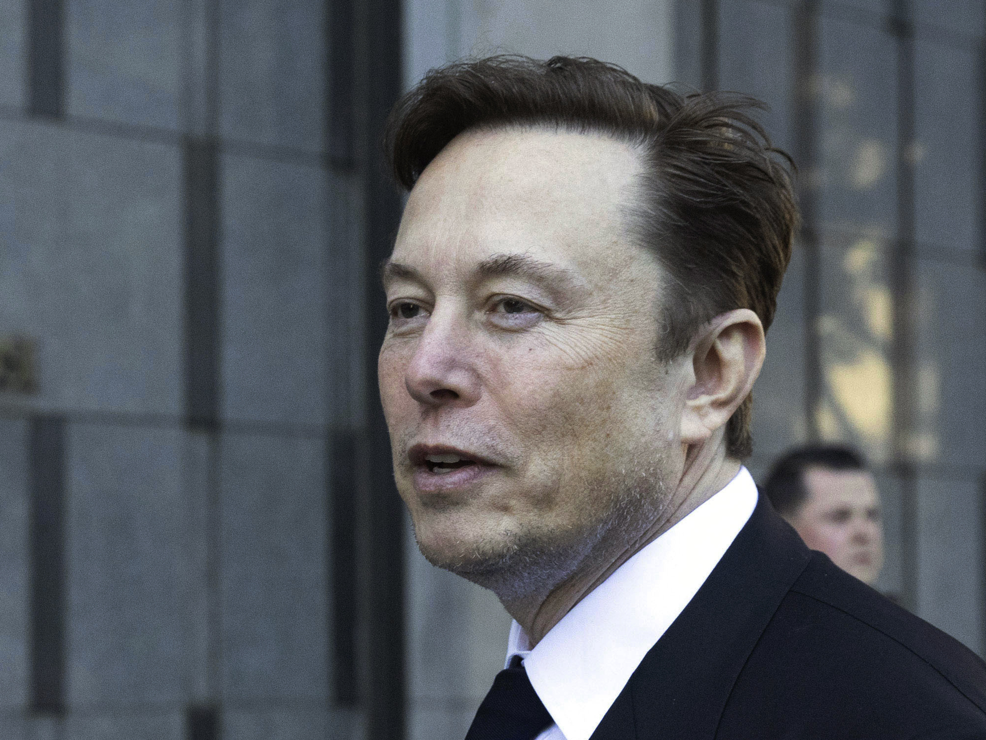 Elon Musk departs the Phillip Burton Federal Building and United States Court House in San Francisco, on Tuesday, Jan. 24, 2023.