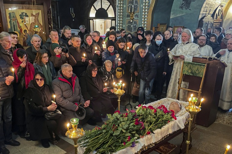 Relatives and friends pay their last respects at the coffin of Russian opposition leader Alexei Navalny.