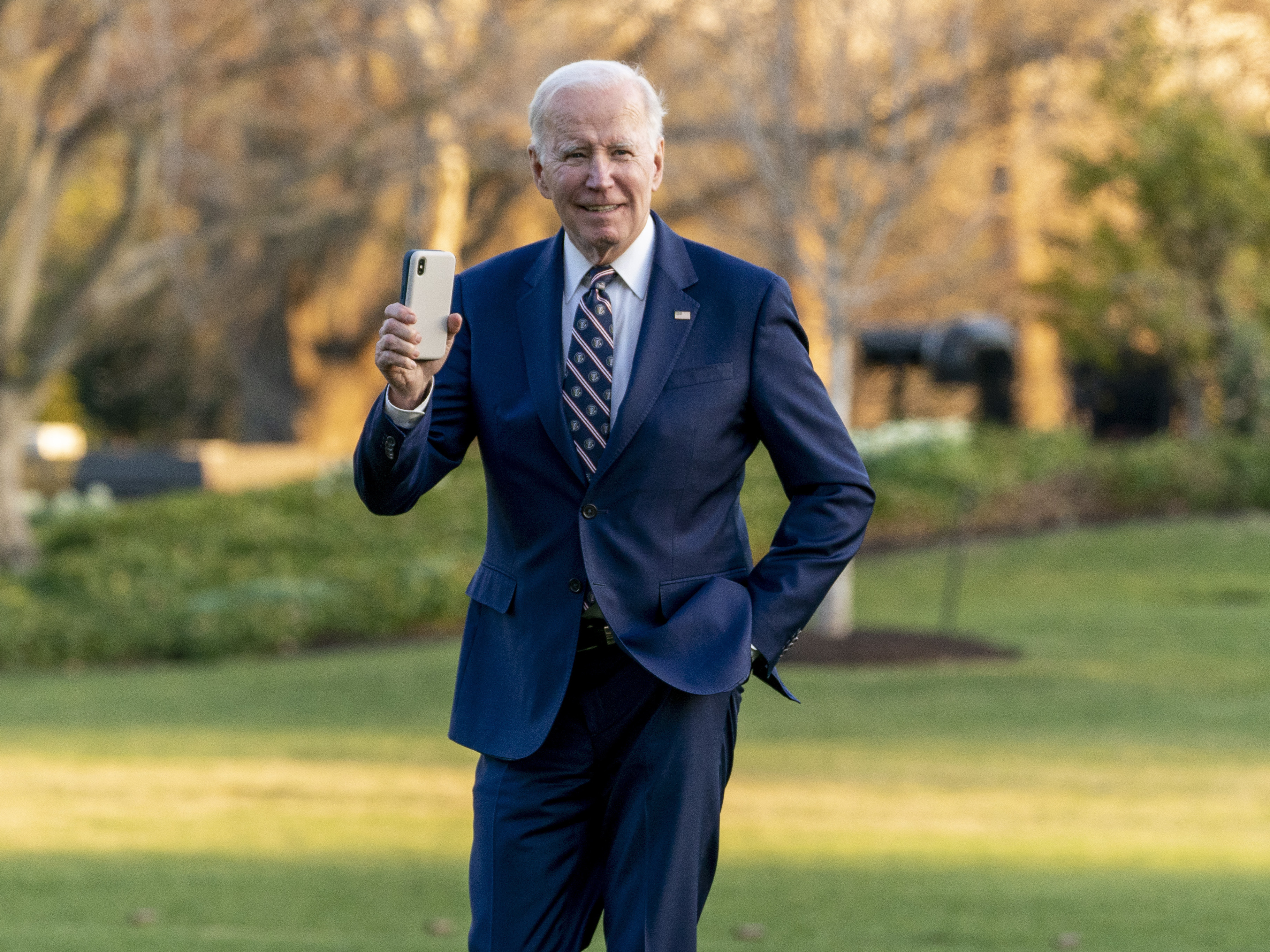 President Biden waves as he arrives at the White House on March 9, 2023.