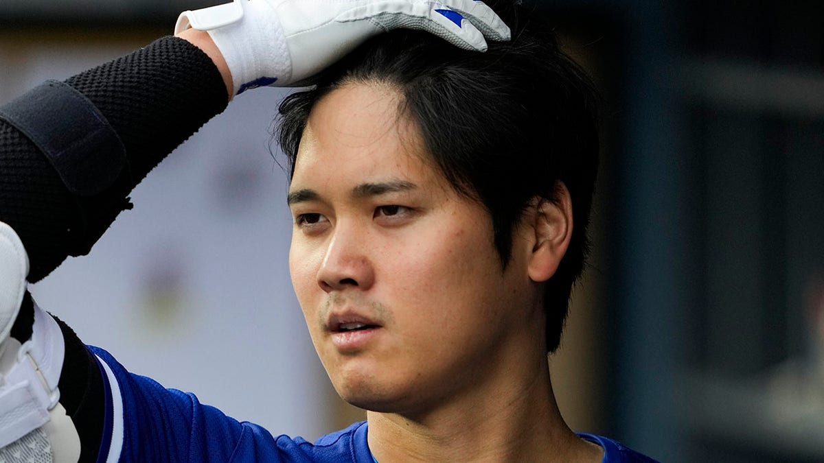 Shohei Ohtani brushes his hair back