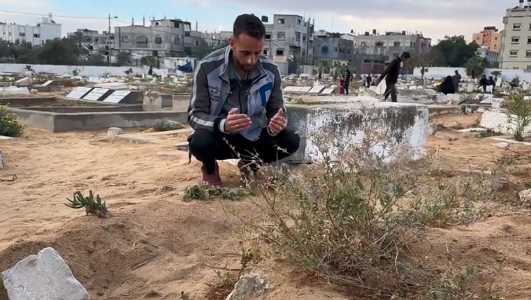 Ahmed al-Jamal prays at the graveside of his 11-year-old son Bassam in Rafah.