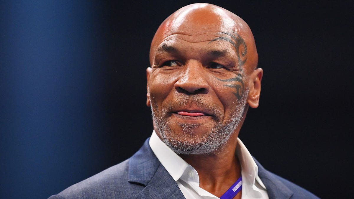 Mike Tyson looks on