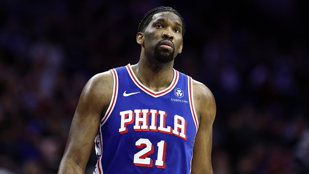 Joel Embiid looks on during a game