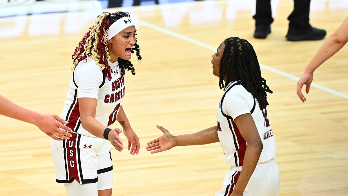 Te-Hina Paopao and MiLaysia Fulwiley celebrate on court