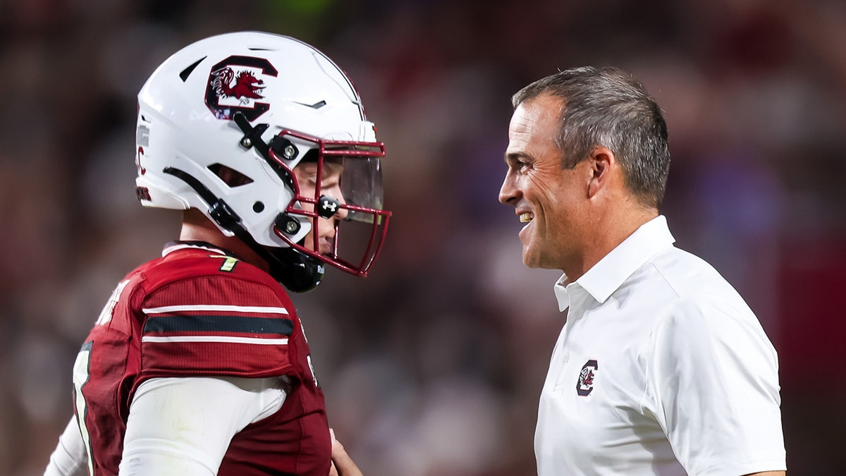 Shane Beamer congratulates Spencer Rattler