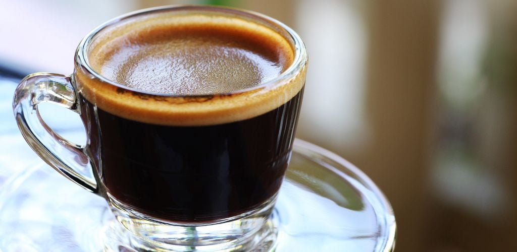 close up of Americano coffee in glass mug