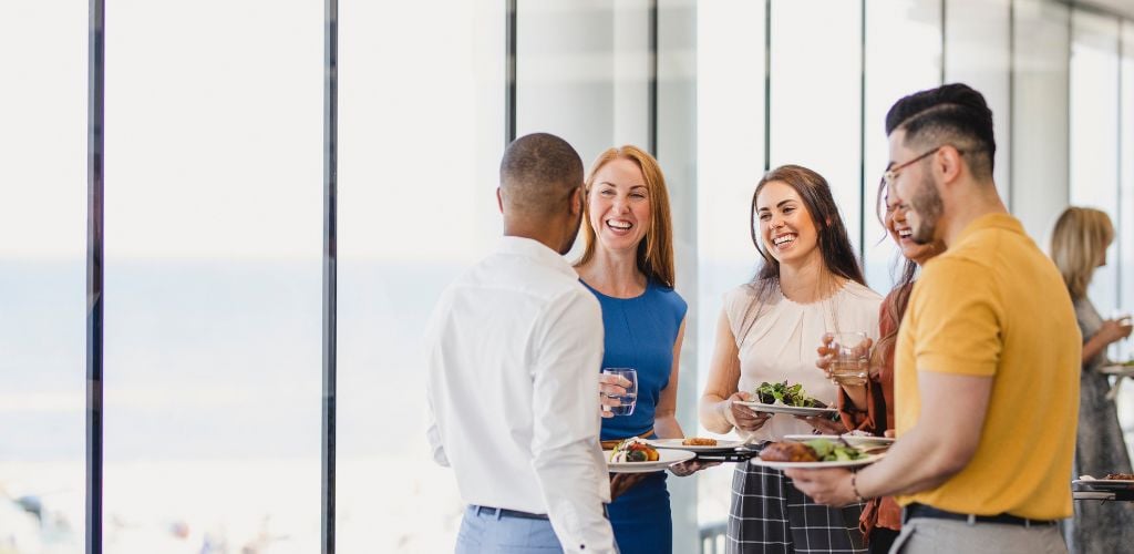 networking/social event, people talking and eating while standing