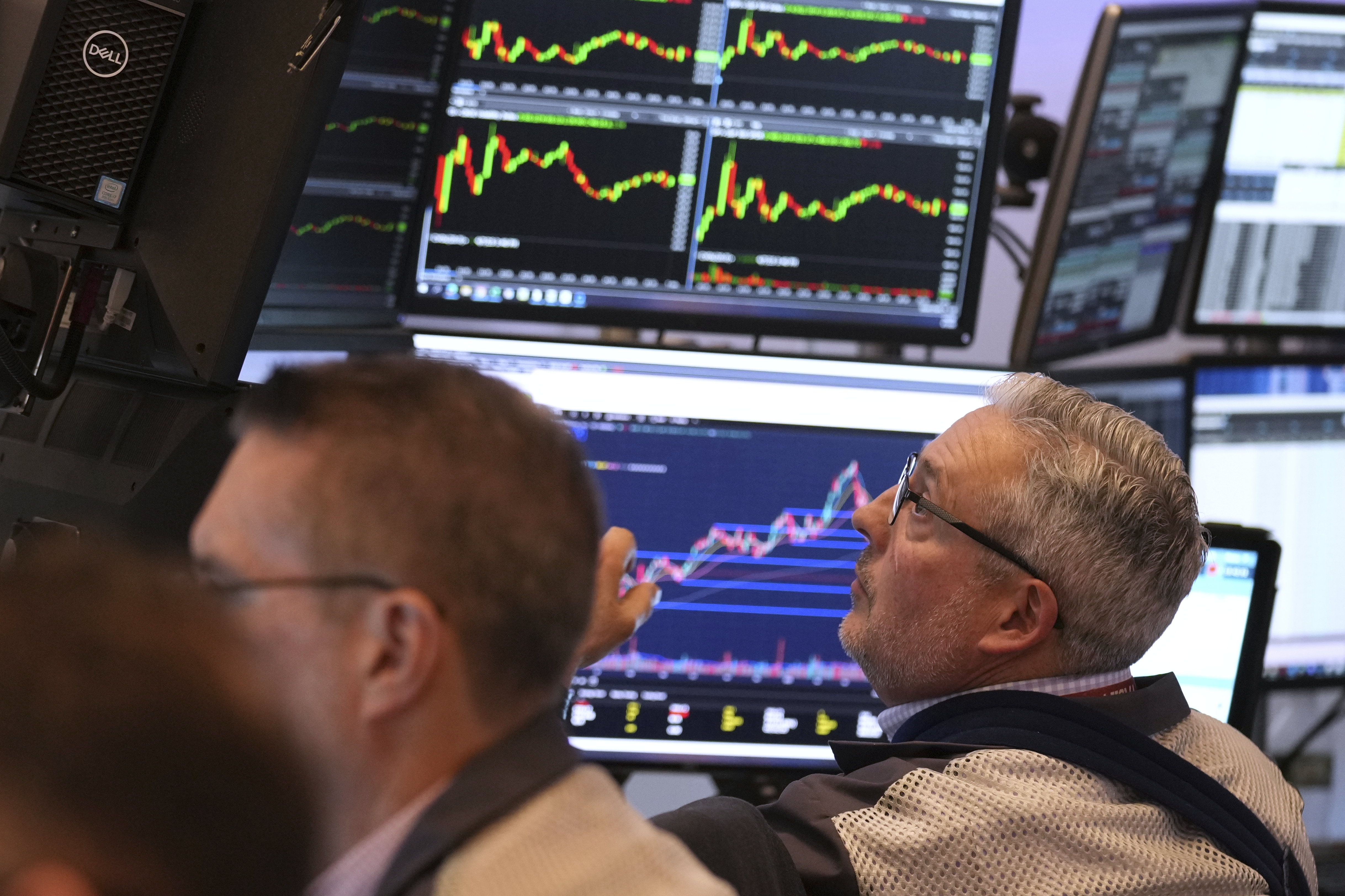 Traders work on the floor Monday at the New York Stock Exchange in New York.