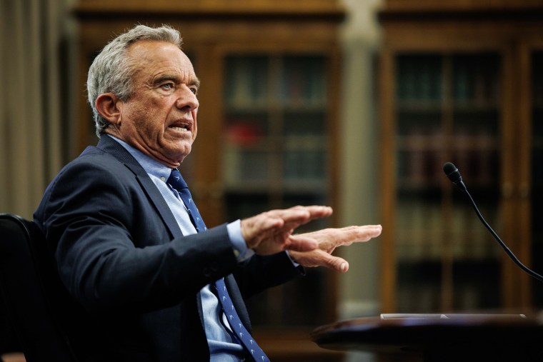 Robert F. Kennedy Jr. gestures while speaking at a hearing.