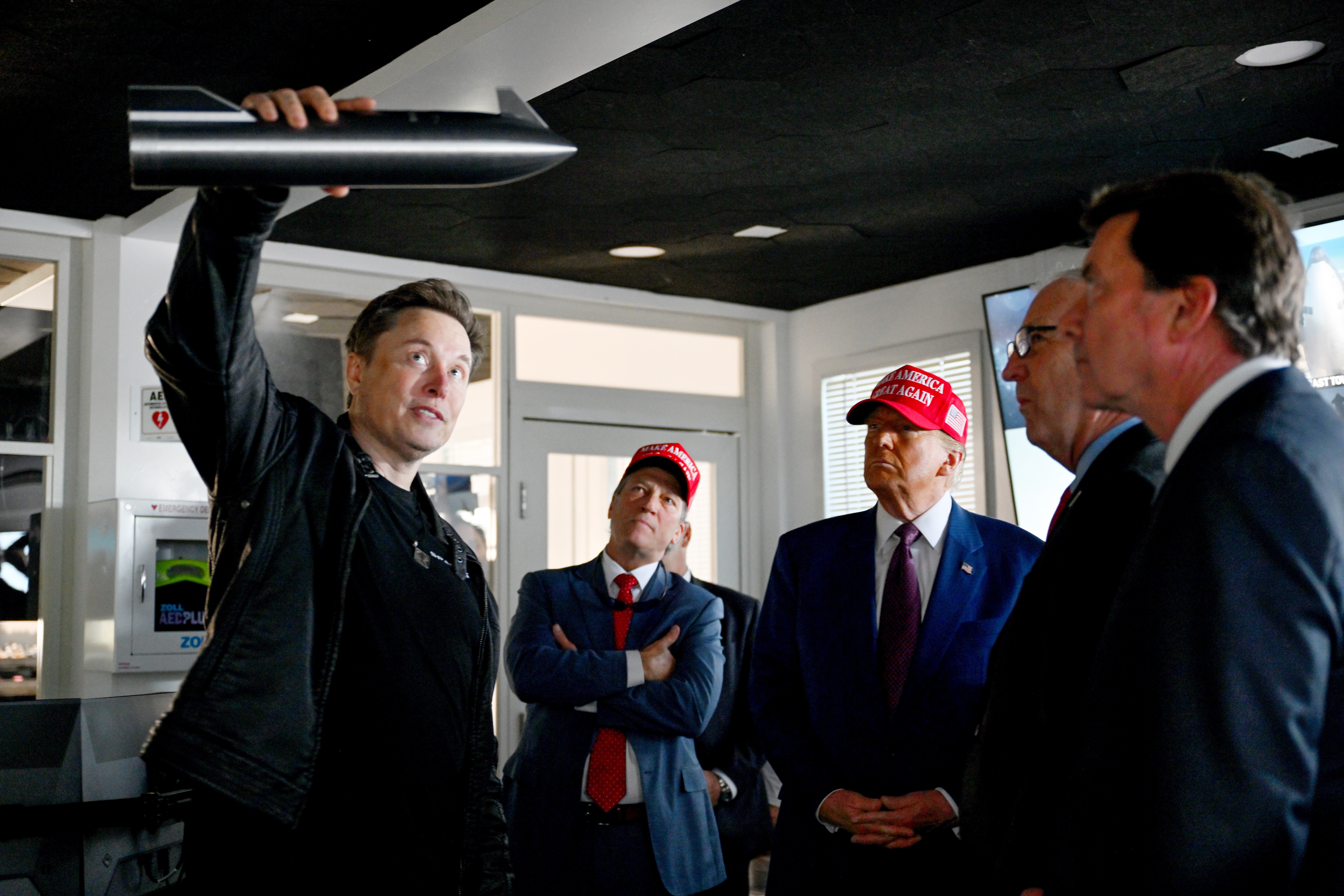 Elon Musk gives a tour to then-President-elect Trump and lawmakers of the control room before the launch of a SpaceX Starship rocket on Nov. 19, 2024, in Brownsville, Texas. Musk