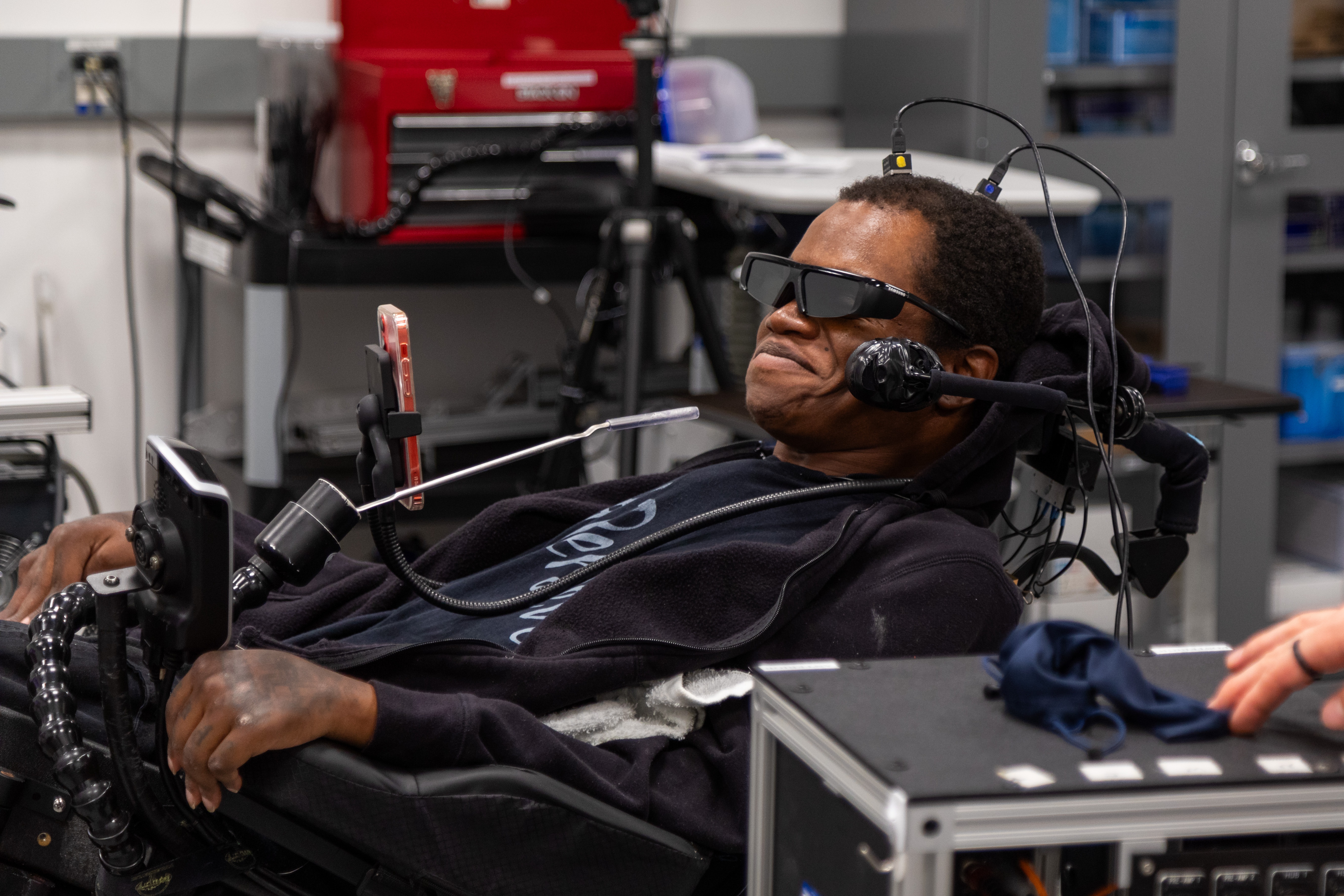 Phillip McKenzie, who was paralyzed from the neck down in a fall in 2012, uses a brain-computer interface developed by researchers at the University of Pittsburgh to navigate complex virtual tasks that simulate everyday activities,