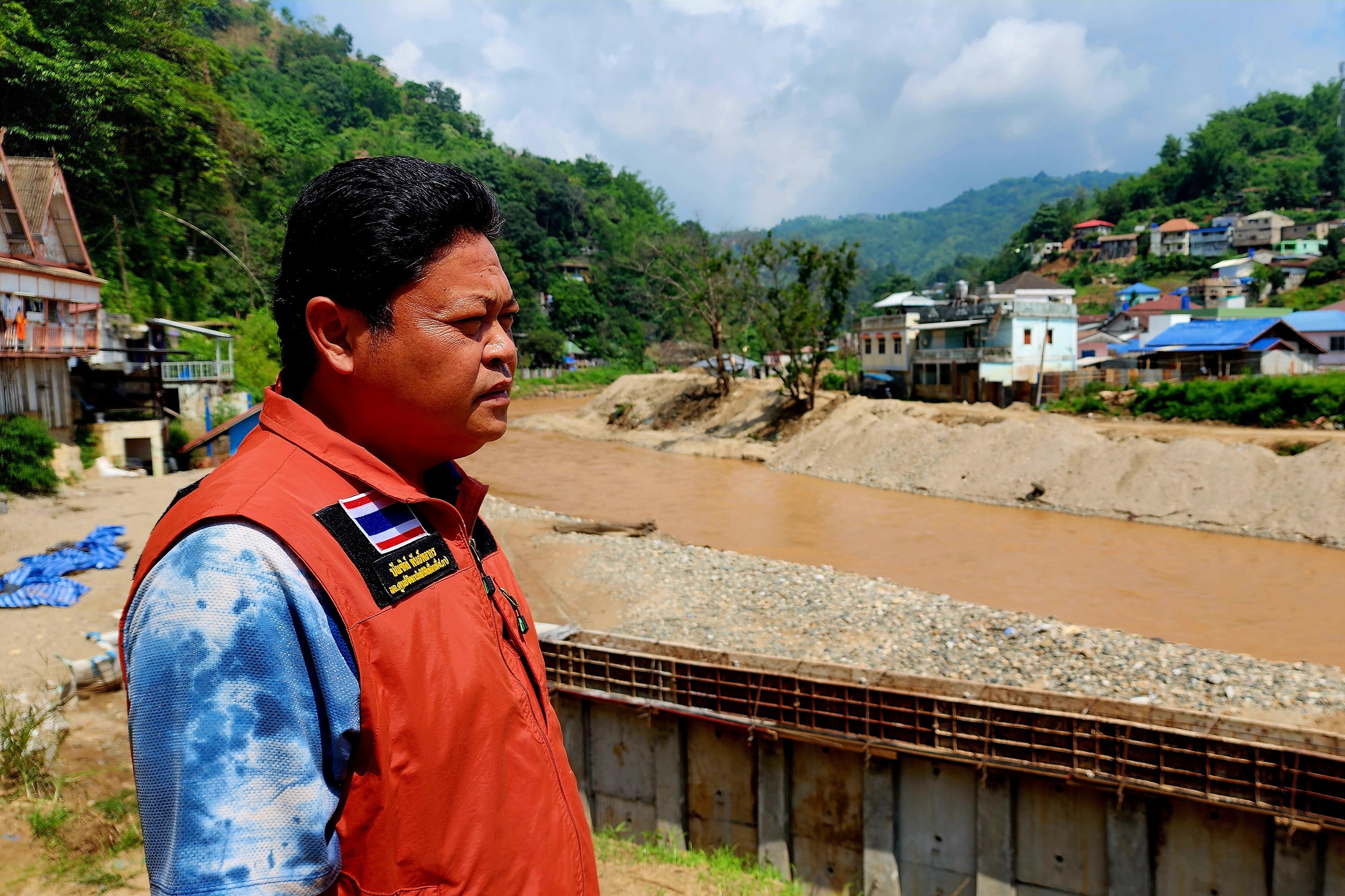 Bundit Pantarakon stands along the Sai river in Mai Sai, where the Thai Army is building flood control barriers along the river that forms the border between Thailand and Myanmar.