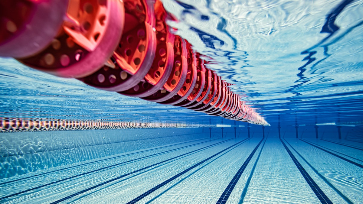 Olympic Swimming pool underwater background.