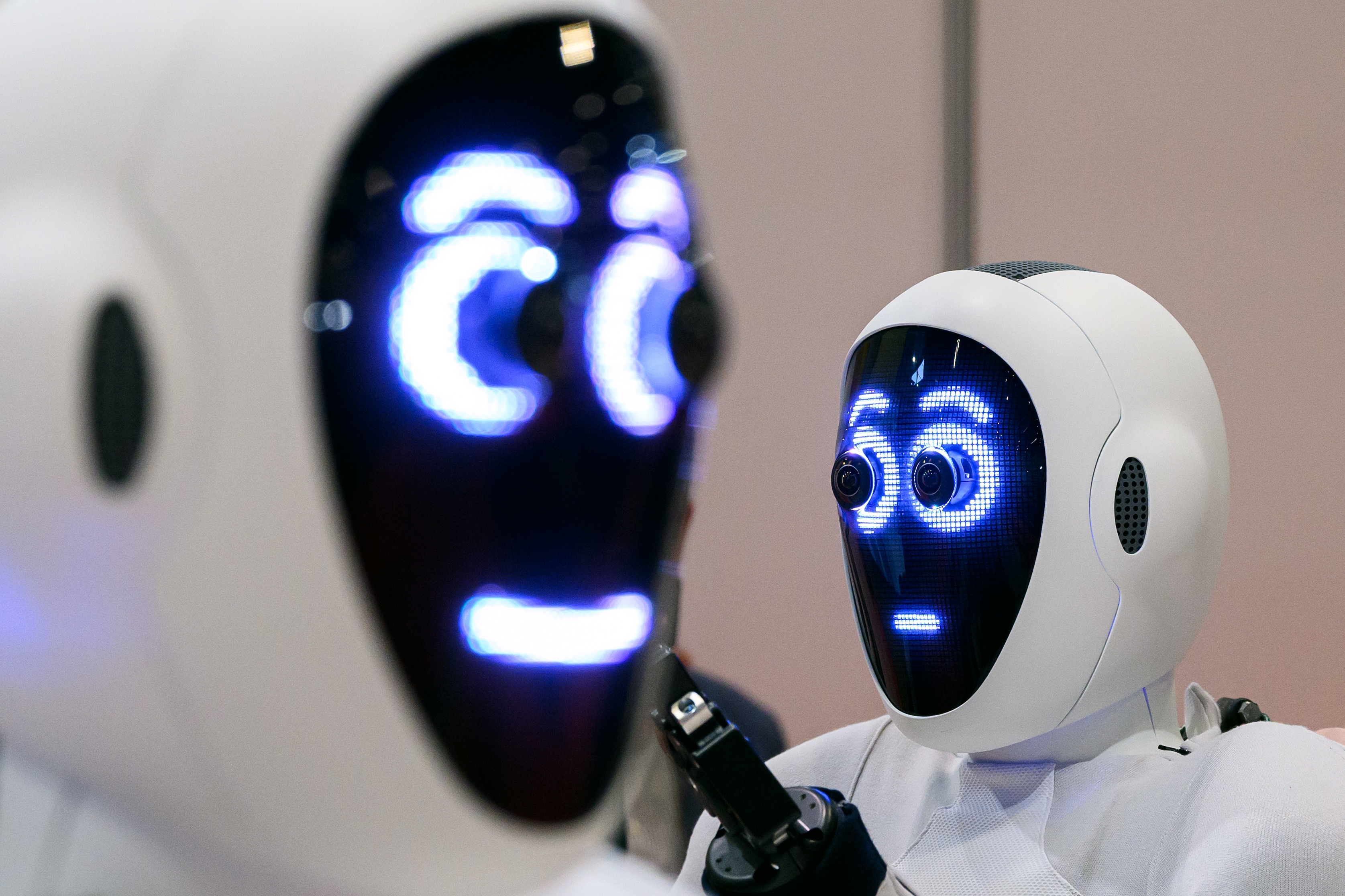 A pair of 1X androids are displayed at the International Conference on Robotics and Automation (ICRA) at ExCel on May 30, 2023, in London.