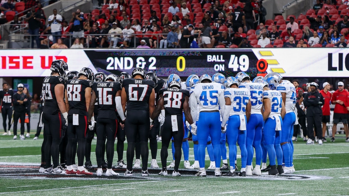 Aug 8, 2025; Atlanta, Georgia, USA; Atlanta Falcons and Detroit Lions players pray after an injury to safety Morice Norris (not pictured) in the fourth quarter at Mercedes-Benz Stadium. Mandatory Credit: Brett Davis-Imagn Images