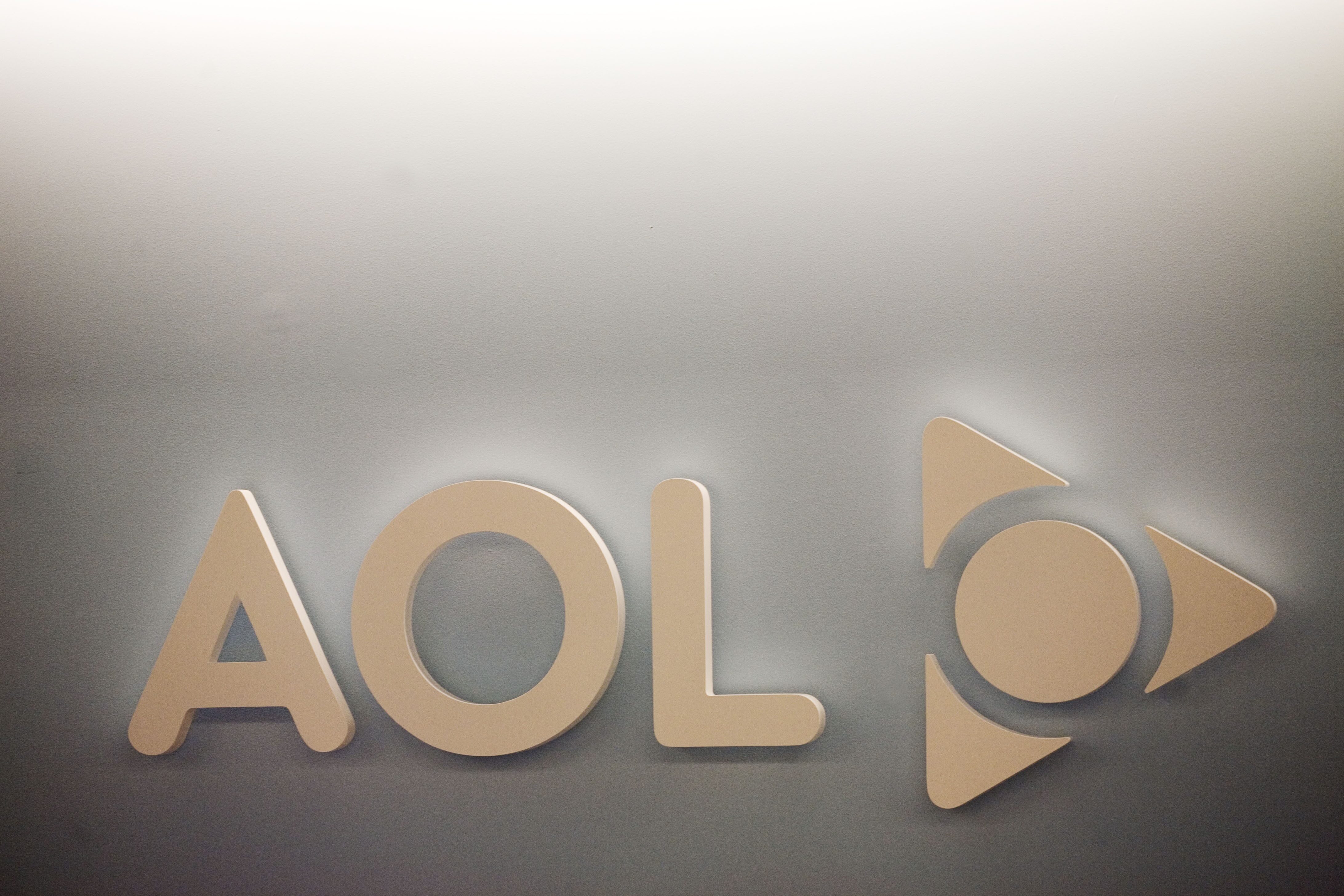 The AOL logo is shown on a wall of the company