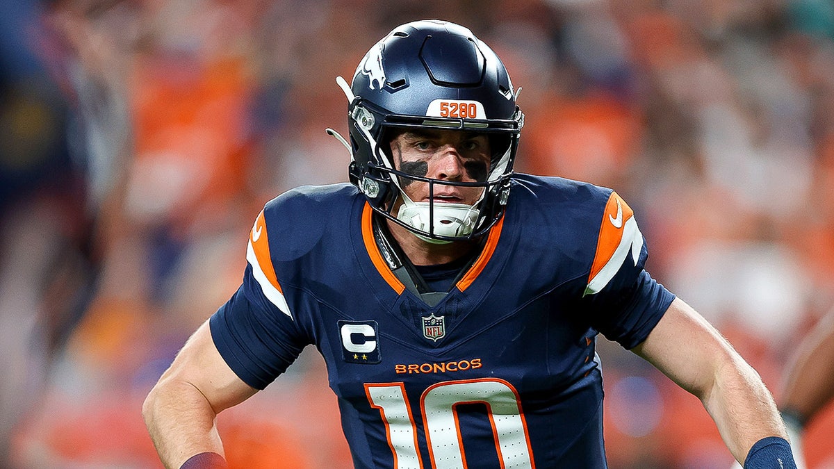 Bo Nix runs on field
