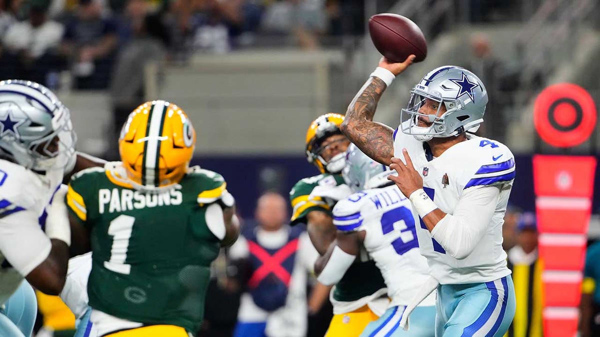 Dak Prescott looks to pass