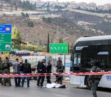 Gunmen kill six and critically injure seven at a Jerusalem bus stop