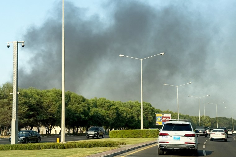 Smoke rises after several blasts were heard in Doha