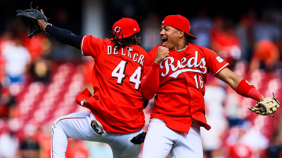 Noelvi Marte celebrates with Elly De La Cruz 