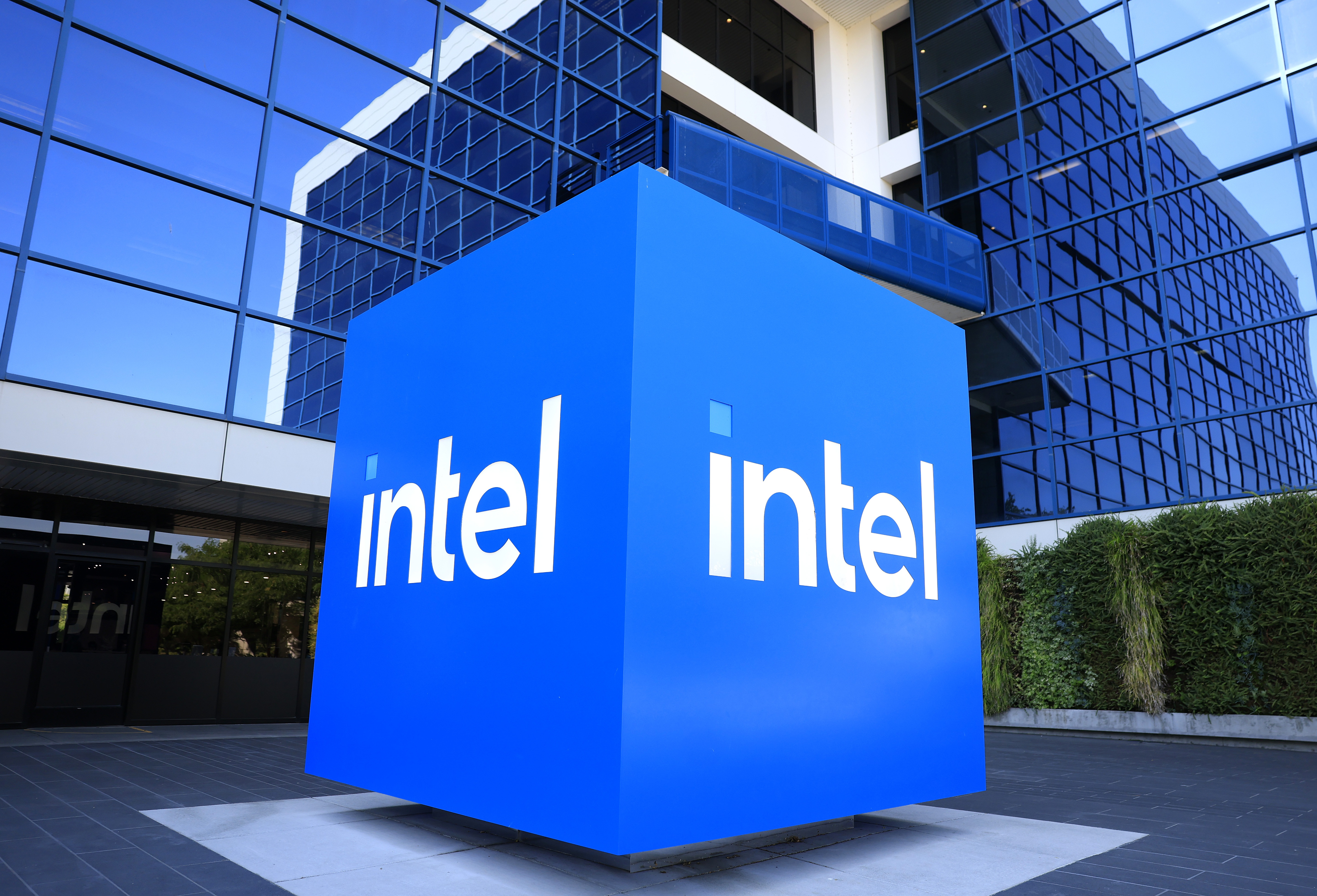 The Intel logo is displayed on a sign in front of Intel headquarters on July 16, 2025 in Santa Clara, California.