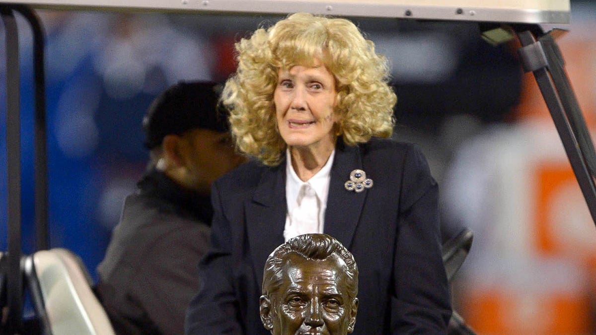 Carol Davis smiles on field