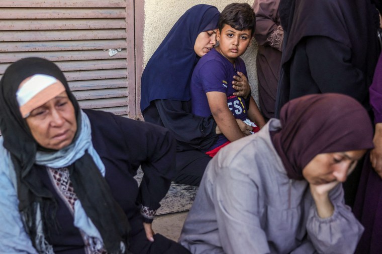 Palestinians mourn.