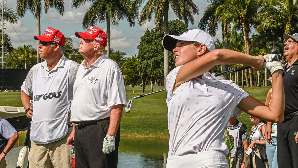 Trump watching Kai's tee shot