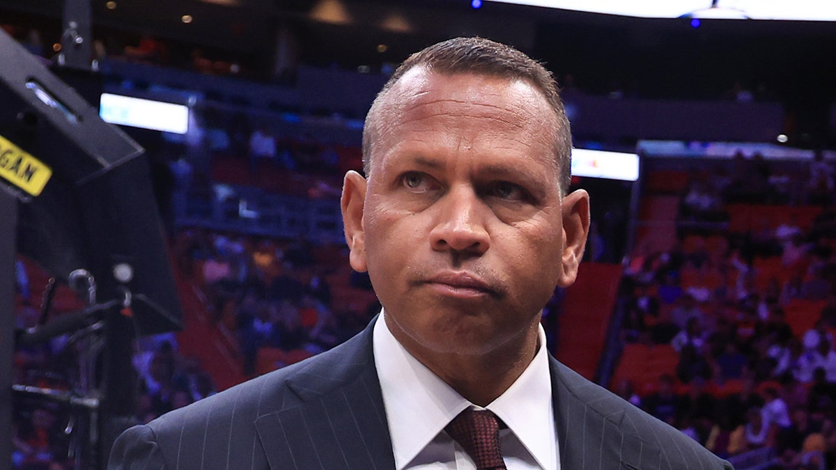 Alex Rodriguez looks on court