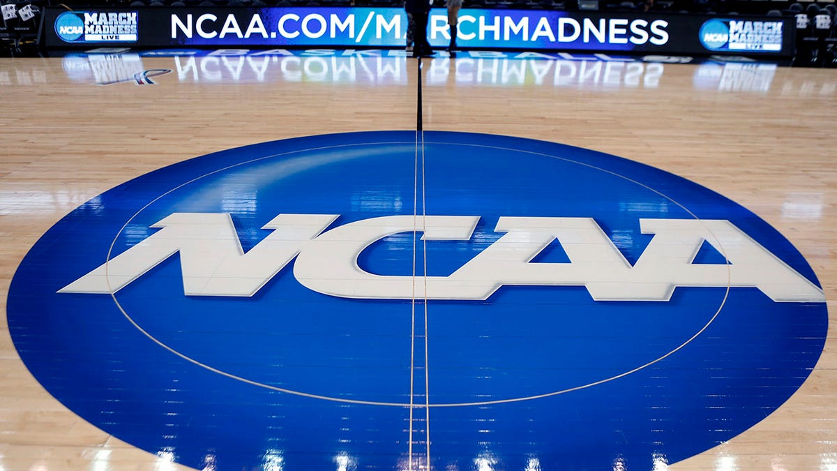 FILE - In this March 18, 2015, file photo, the NCAA logo is at center court as work continues at The Consol Energy Center in Pittsburgh, for the NCAA college basketball second and third round games. Bank records and other expense reports that are part of a federal probe into college basketball list a wide range of impermissible payments from agents to at least two dozen players or their relatives, according to documents obtained by Yahoo Sports. Yahoo said Friday, Feb. 23, 2018, that the documents obtained in discovery during the investigation link current players including Michigan State's Miles Bridges, Duke's Wendell Carter and Alabama's Collin Sexton to potential benefits that would be violations of NCAA rules. (AP Photo/Keith Srakocic, File)
