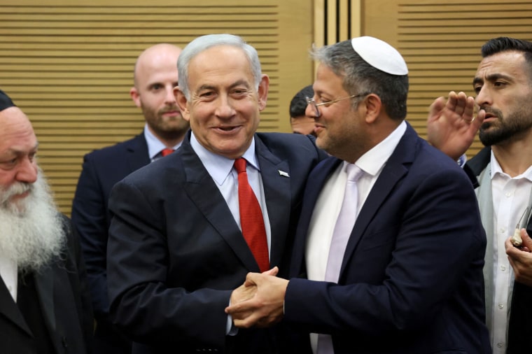 Benjamin Netanyahu and Itamar Ben-Gvir shake hands.