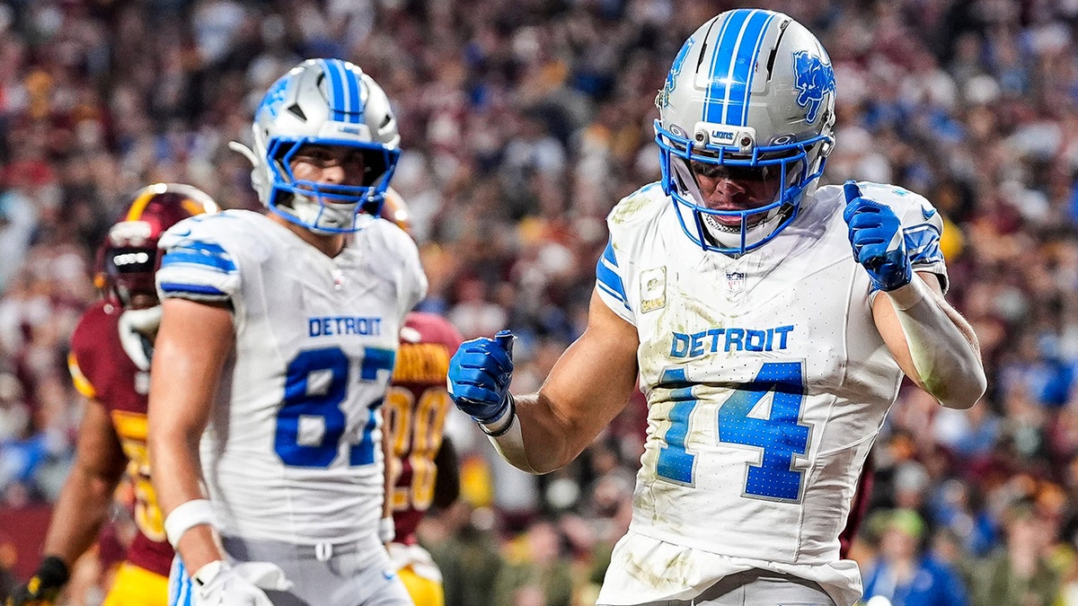 Amon-Ra St. Brown celebrates a TD