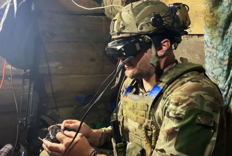 Dmytro Melnyk operates a battle drone from an undisclosed location on the front lines in June 2024.