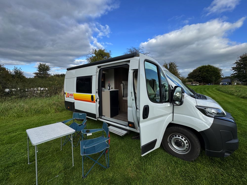 outside campervan with doors open