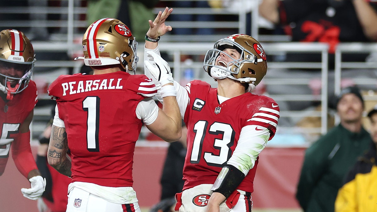 Brock Purdy celebrates touchdown