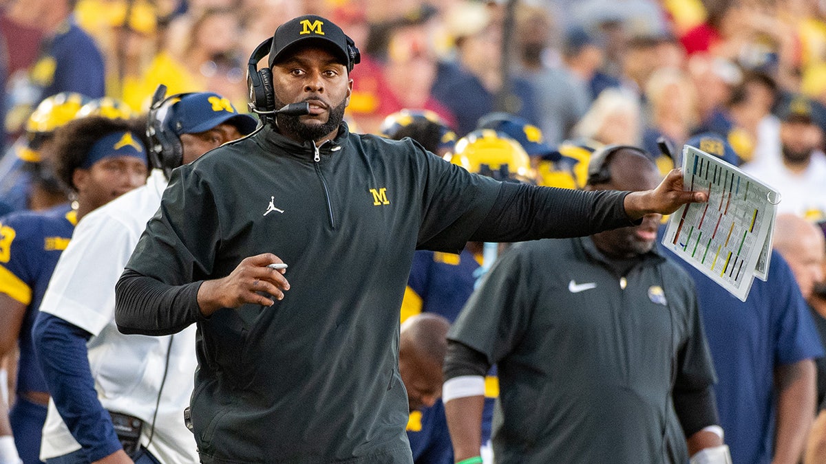 Sherrone Moore reacts
