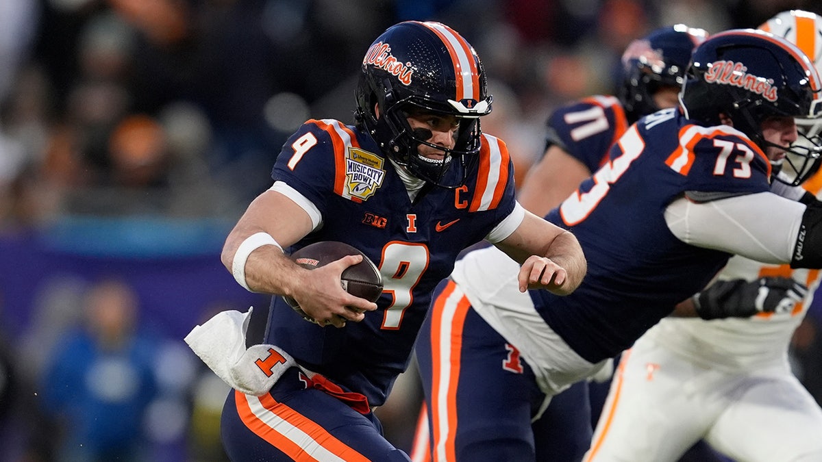 Luke Altmyer runs the ball