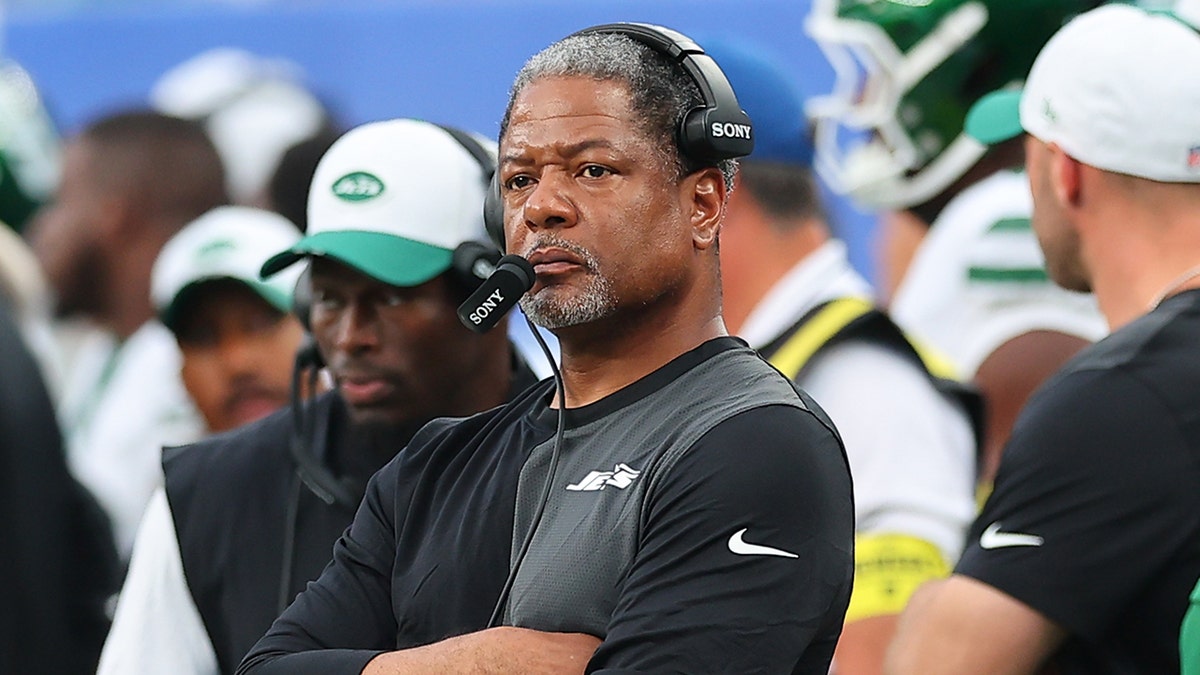 Steve Wilks arms folded on field