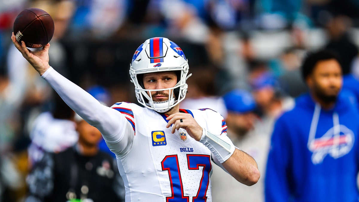 Josh Allen warms up