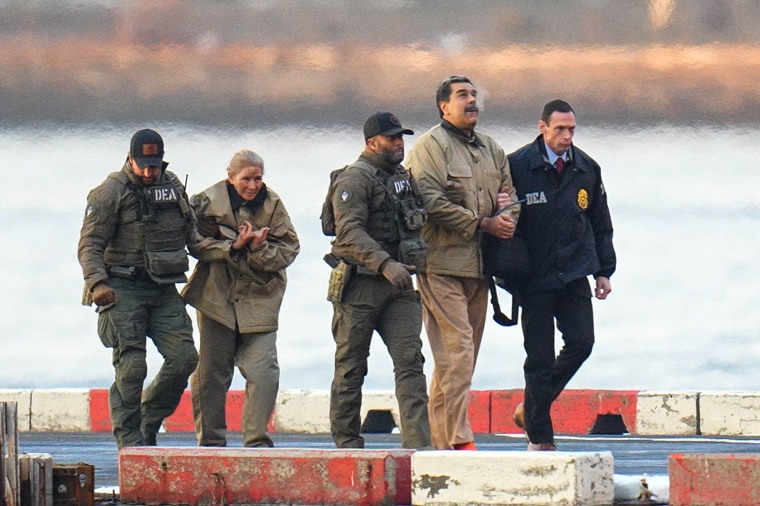 Former Venezuelan President Nicolás Maduro and his wife, Cilia Flores, are escorted to a federal courthouse in New York City this month.
